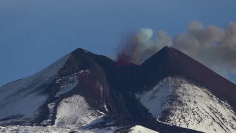 Italy's Etna puts on spectacular show at dawn