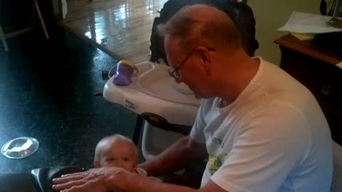 Bodhi playing up-down with Grampa