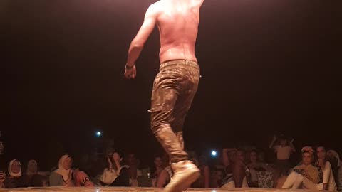 Guy Dance With Metal Star On Fire Show