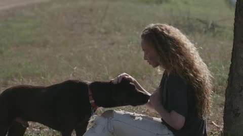 Video of a Woman Touching Dog