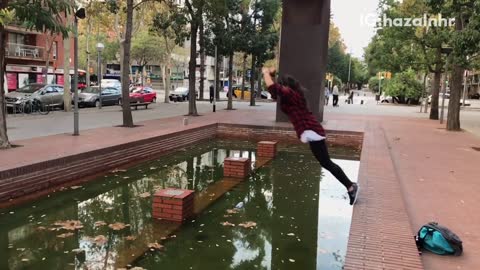 Black red flannel girl parkour falls into fountain