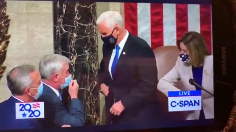 Pence (Judas) receives a coin after giving the ol' Masonic handshake