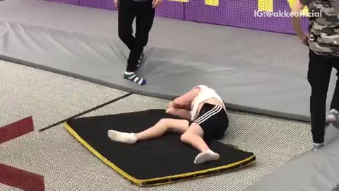 Guy does triple front flip on trampoline and gets his head stuck underneath safety mat