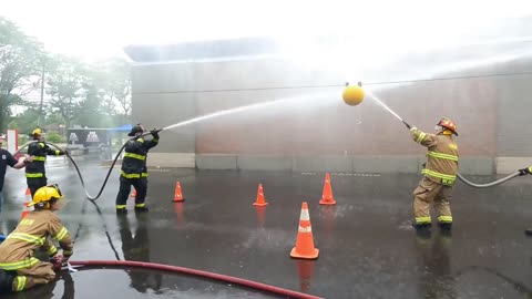 Local Fire Departments Compete In Waterball For The Title During Patriots Week