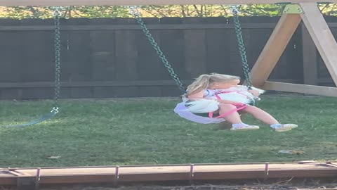 Girl and Dog Tumble Out of Swing Together