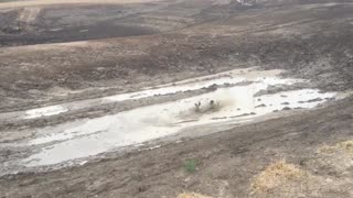 Rain Turns Dry Dam Into Outback Waterslide