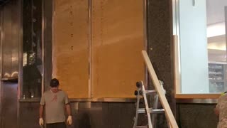 Boarding up windows in Midtown after looting