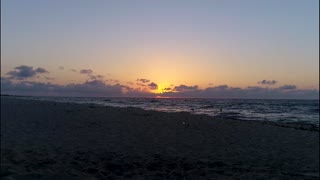 Sunrise over water - Time Lapse