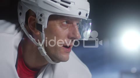 Concentrated Ice Hockey Player Breathing And Looking In Front Of Him