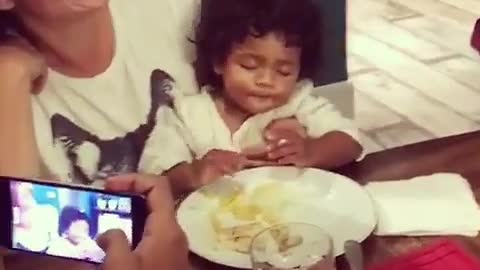 Baby can't decide between sleeping or eating, does both