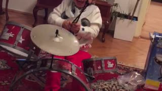 the baby plays drums
