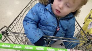 Kid Can't Stay Awake in Shopping Cart