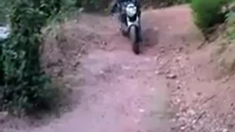 Guy trying to do flip while riding motorcycle falls