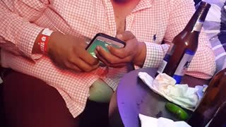 Overly Drunk Man Struggles with Phone