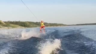 Guy slow mo red shorts wake board fail