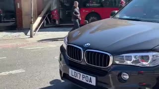 London bus curses into a shop