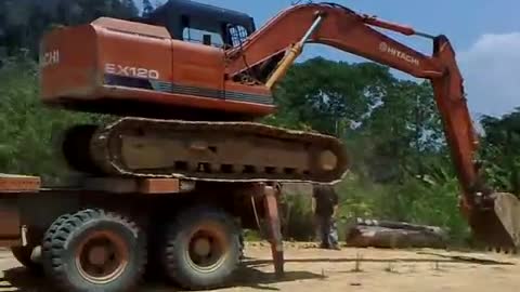 Extreme Maneuver - Unloading the Excavator