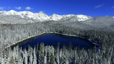 aerial flight over wintry snow