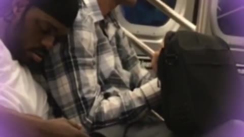 Man in white shirt sleeps on man with blue flannel