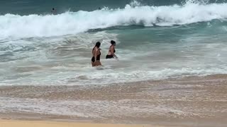 Strong Wave Slams Unprepared Swimmer Into the Sand