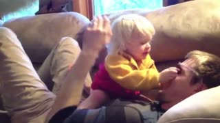 Adorable Baby Protects Dad In Pillow Fight