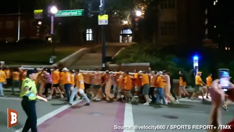 U of Tennessee Students March Goal Post Through Streets After Win, Followed by Police Cruisers