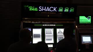 People playing a giant slot machine in Las Vegas.