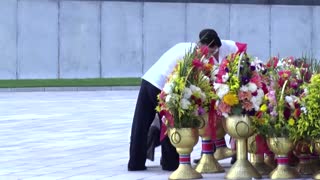 North Koreans mark anniversary of former leaders