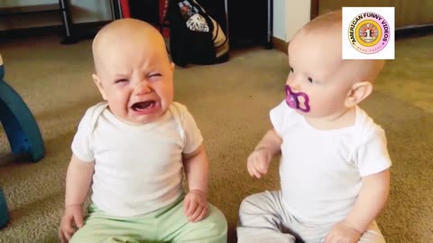 Twin baby girl's fight over pacifier
