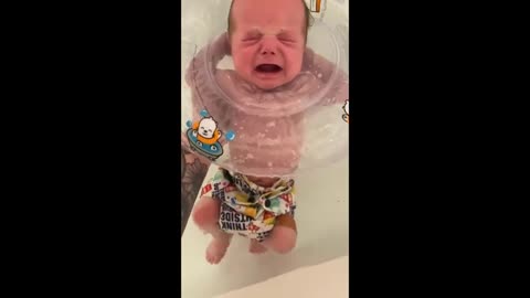 Baby With Head Floater Sleeps While Floating in Bathtub