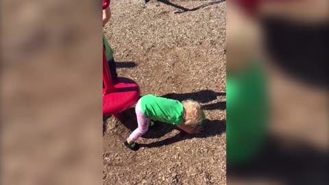 Dizzy Toddler Goes For A Spin At The Playground