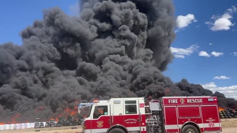 Fire crews work to contain large industrial fire near airport in Albuquerque