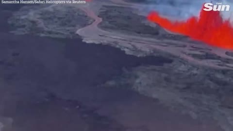 World's largest volcano violently erupts in Hawaii as helicopter flies over