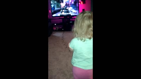 Toddler Rocks Out On Guitar Hero
