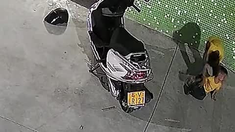 Chinese boys lift scooter up to free trapped brother #shorts