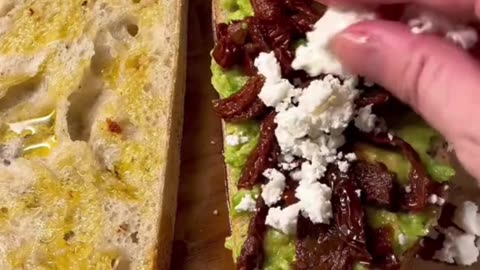 AVOCADO SUNDRIED TOMATOS CHOPPEDUP STEAK WITH FETA ON SOURDOUGH