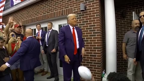 WATCH: Trump Tosses Footballs To Cheering Crowd In Iowa