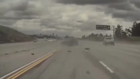 Incredible video shows car flipping after being hit by loose tire
