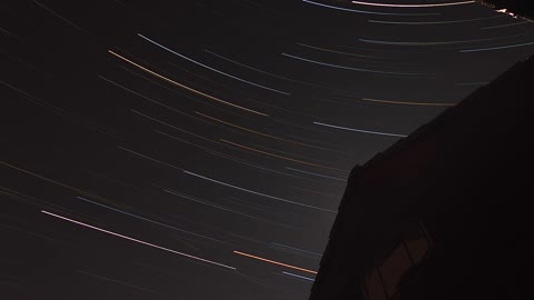 Star trails fade in the morning light time lapse
