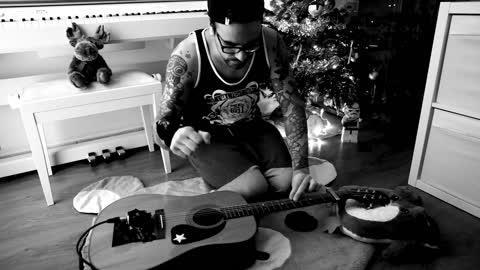 Guitarist's jaw-dropping technique plays Christmas song