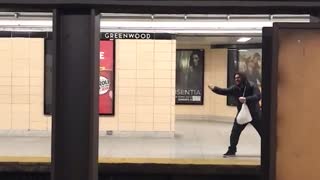 Man with hoodie pretend to pull in train