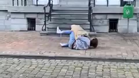 Guy Trying to Jump Onto Friend's Back Tumbles to the Ground