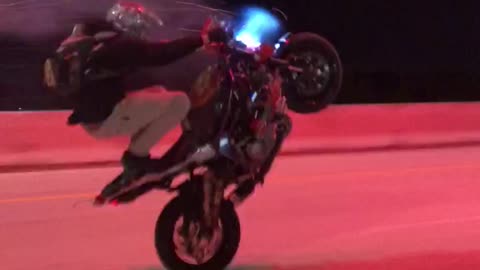 Professional Rider Wheelies with Fireworks