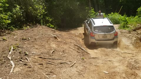 Subaru crosstrek climbing near vertical hill