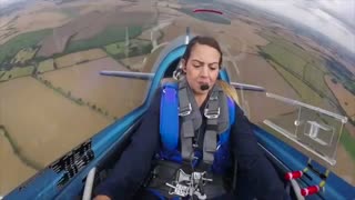Female aerobatic pilot enduring negative G torture