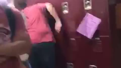 Guy red shirt trips and runs into red lockers