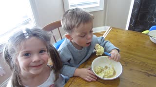 Boy and Girl eating squirrel gravy