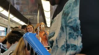 Man plays "despacito" with a melodica on a bus