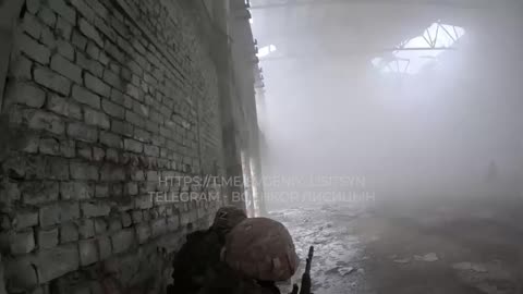 Footage of Russian soldiers evacuating a wounded enemy on the battlefield.