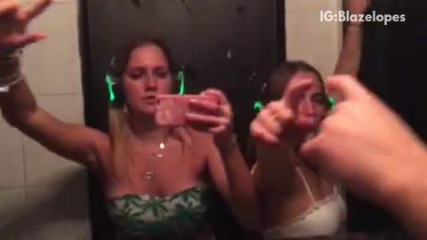 Girls green lights in ears dancing in mirror